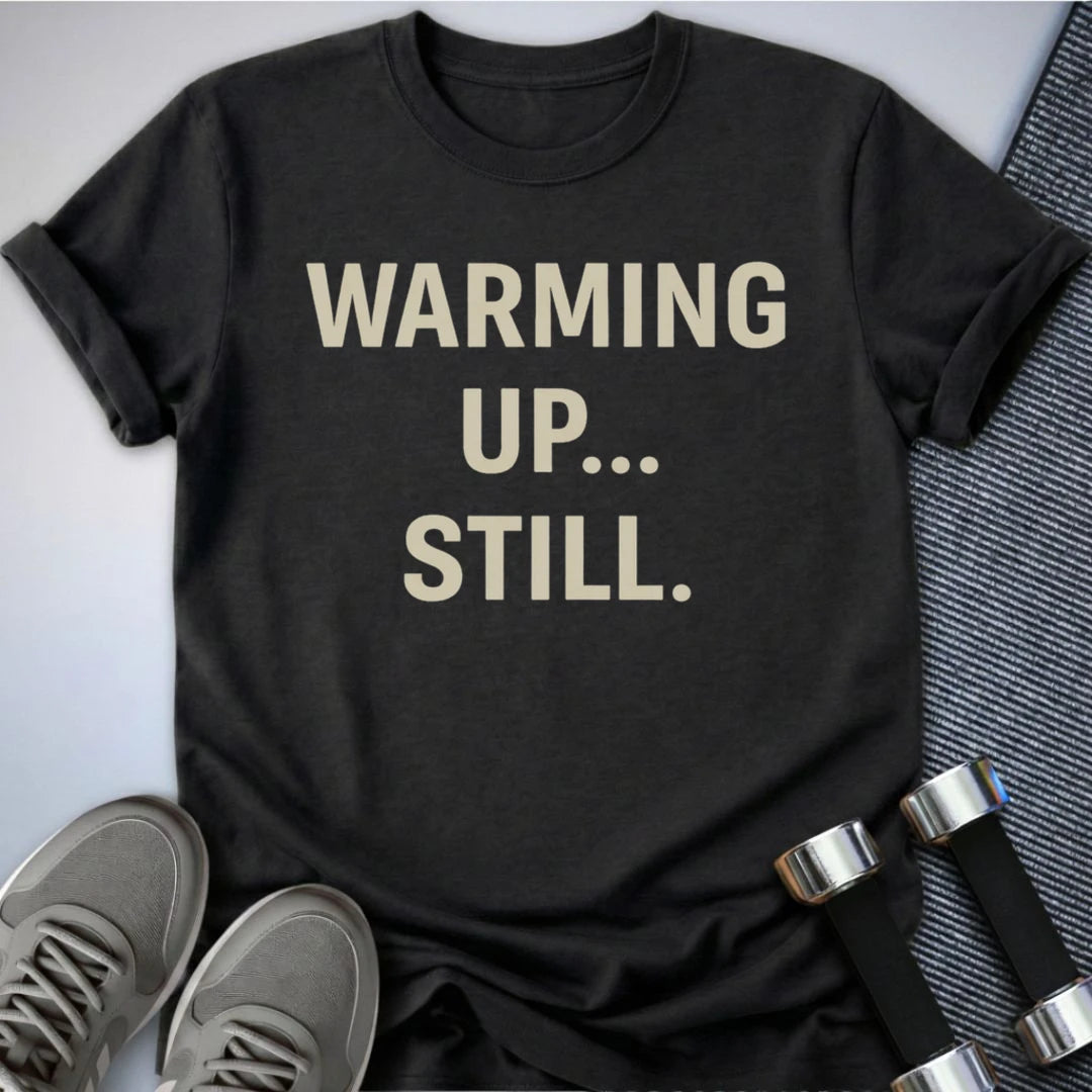 Printify T-Shirt Dark Grey Heather / S Still Warming Up T-Shirt