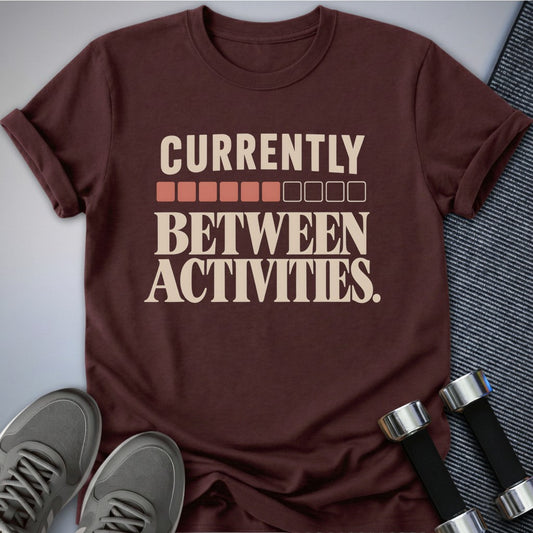 Printify T-Shirt Maroon / S Currently Between Activities T-Shirt